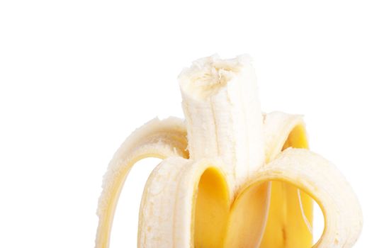 Closeup view of bitten off banana isolated over white.