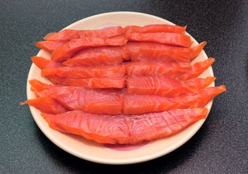 Fresh wild salmon fish fillet steaks on a plate