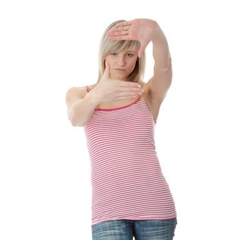 Young attractive woman framing her face with hands, over white