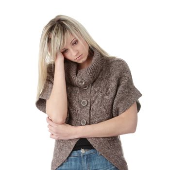 Young caucasian woman (student or businesswoman) with severe Migraine Headache holding hands to head