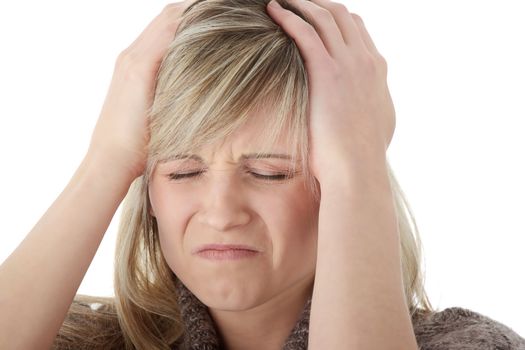 Woman with headache holding her hand to the head, isolated on white
