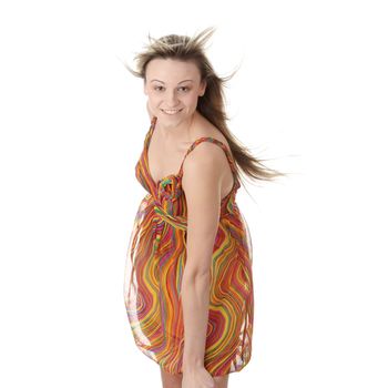 Portrait of beautiful girl model in summer dress with fluttering hair and dress