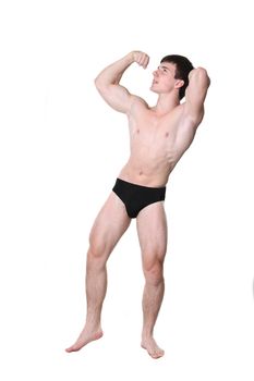 The young body builder poses with greater muscles on a white background