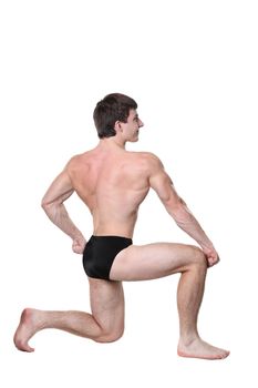 The young body builder poses with greater muscles on a white background
