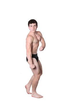 The young body builder poses with greater muscles on a white background