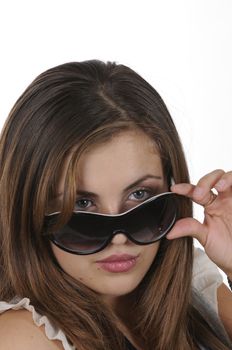 closeup of pretty hispanic model looking over sunglassesisolated on white