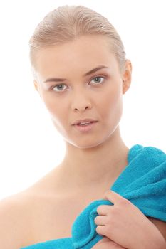 Portrait of the beautiful naked woman covering her body with blue towel,isolated on white background