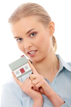 Young beautiful business woman with house model - real estate