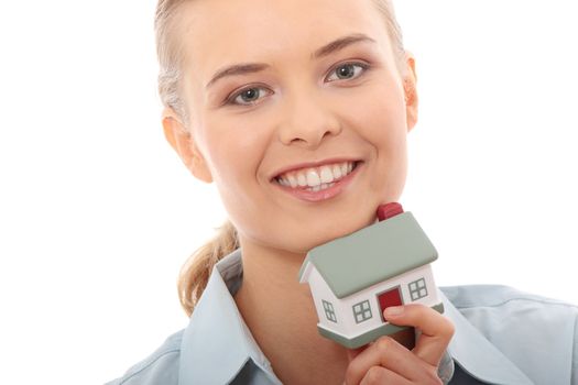 Young beautiful business woman with house model - real estate