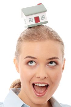 Young beautiful business woman with house model - real estate