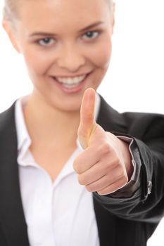 Young business woman showing OK sign, looking at camera and smiling. Isolated on white background. Focus on hand