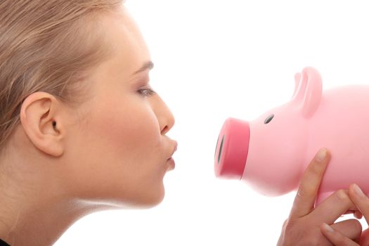 Businesswoman holding piggy bank. Isolated on white background