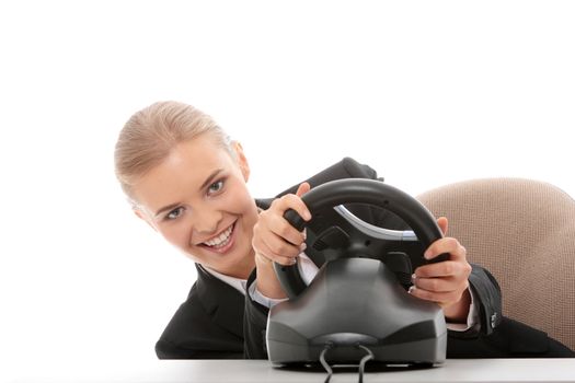 Young caucasian business woman playing on computer (with steering wheel), isolated on white background