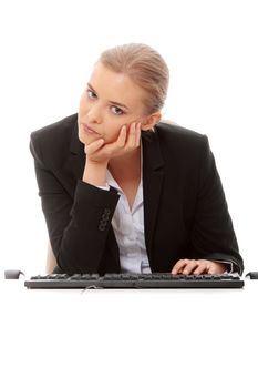 Bored businesswoman working on pc, isolated on white background