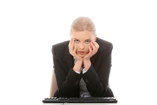 Bored businesswoman working on pc, isolated on white background