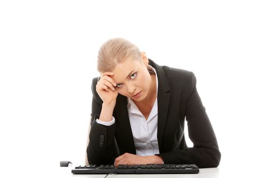 Bored businesswoman working on pc, isolated on white background