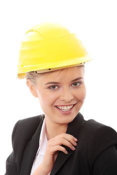 Portrait of confident female worker in helmet isolated on white background