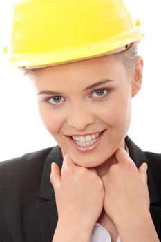 Portrait of confident female worker in helmet isolated on white background