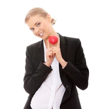 Young business woman holding heart shaped toy