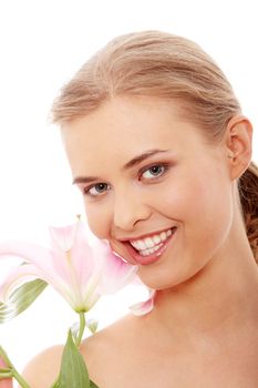 Portrait of the attractive girl without a make-up, with lily flower in hand, isolated on white background