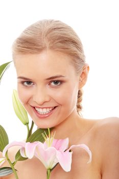 Portrait of the attractive girl without a make-up, with lily flower in hand, isolated on white background