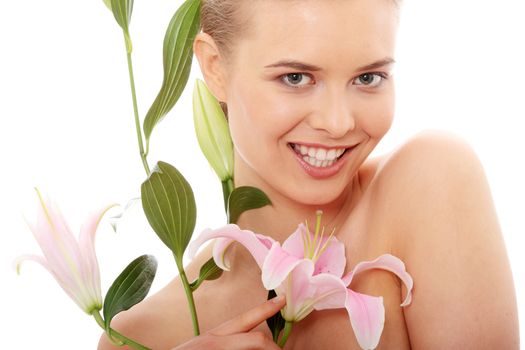 Portrait of the attractive girl without a make-up, with lily flower in hand, isolated on white background