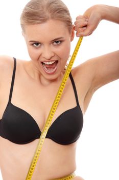 Beautiful young caucasian woman measuring her body with tape, isolated on white background