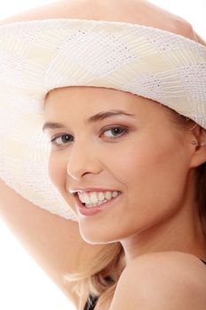 Beautiful young caucasian woman in swimsuit and hat, isolated on white background