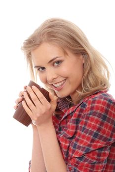 The beautiful young woman drinks morning coffee or tea