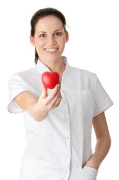 Young nurse with heart in her hand, isolated on white background
