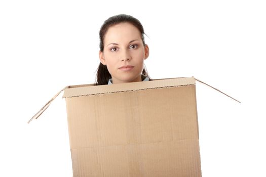 Thinking inside a box. Young business woman in cardboard box, isolated on white