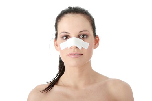Young beautiful woman face after nose surgery