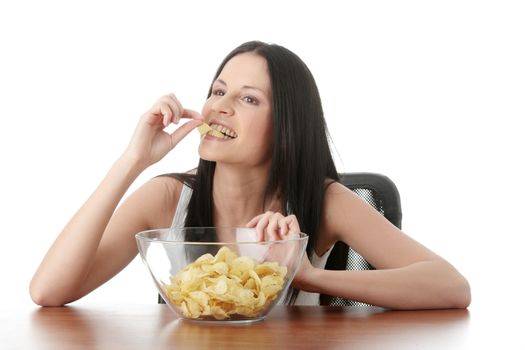 Young beautiful woman eating chips, isolated on white