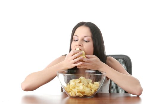 Young beautiful woman eating chips, isolated on white