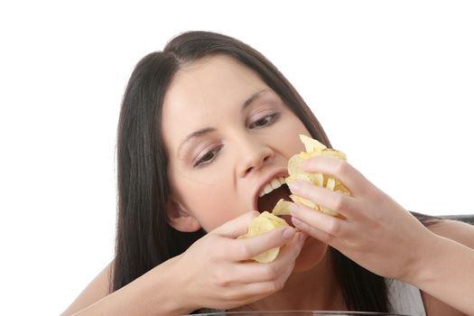 Young beautiful woman eating chips, isolated on white