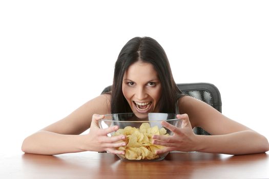 Young beautiful woman eating chips, isolated on white