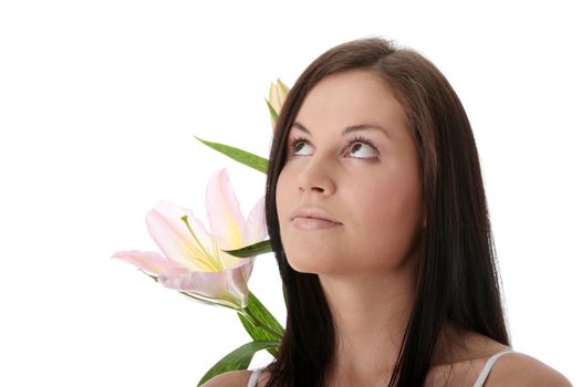 Beautiful young woman with lily flower. Isolated