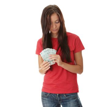 Cheerful young lady holding cash (polish zloty), isolated on white background