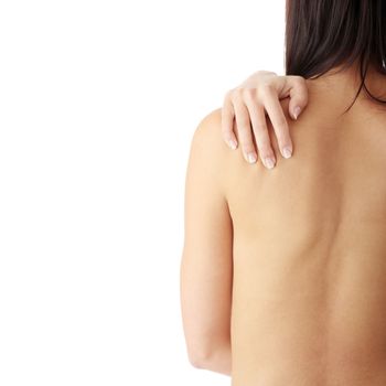 Nude woman from behind. Back pain concept. Isolated