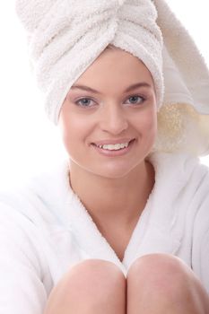 Portrait of young beautiful woman wearing bathrobe, isolated on white