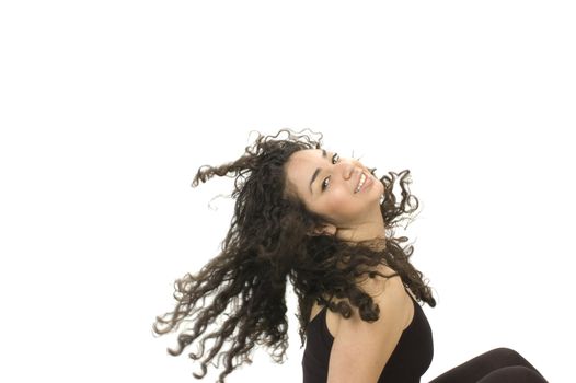 Beautiful young hispanic brunette woman swinging hair back