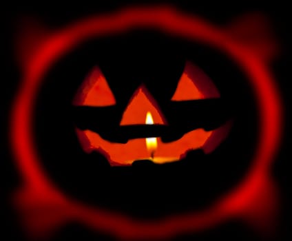 A scary Halloween pumpkin on black 
