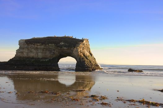 A natural archway created by the erosion of the sea