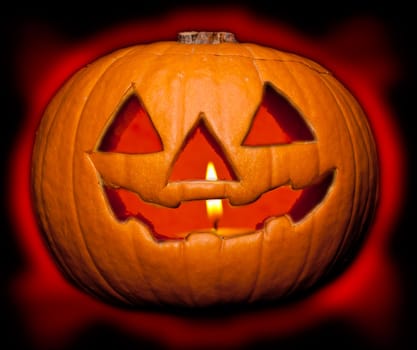 A scary Halloween pumpkin on black