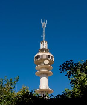 Communications tower with a beautiful blue sky