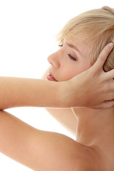 Woman with headache holding her hands to the head, isolated on white