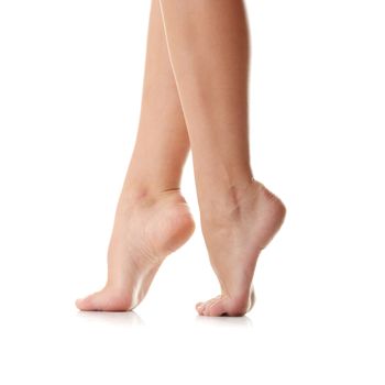 Long pretty woman legs isolated on white