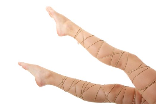 Legs pain concept - legs tied with rope isolated on white