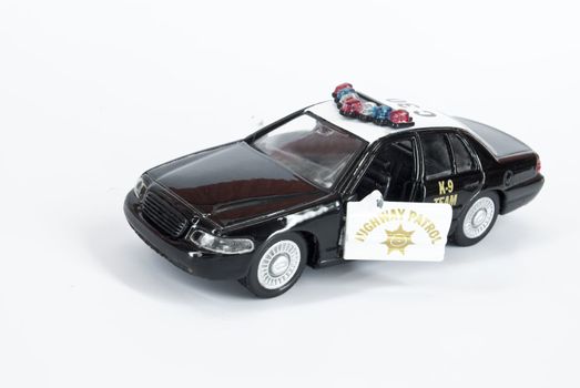 An old 	toy police car k-9 team
