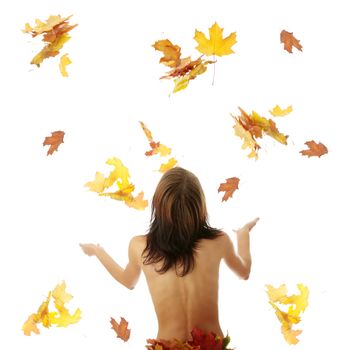 Young nude caucasian woman playing with autumn colorful leaves. Isolated on white